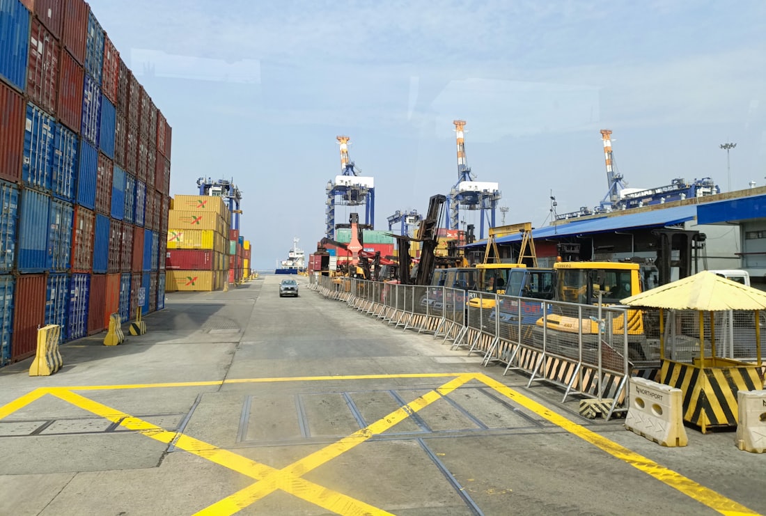 Shipping containers and gantry cranes at a port terminal