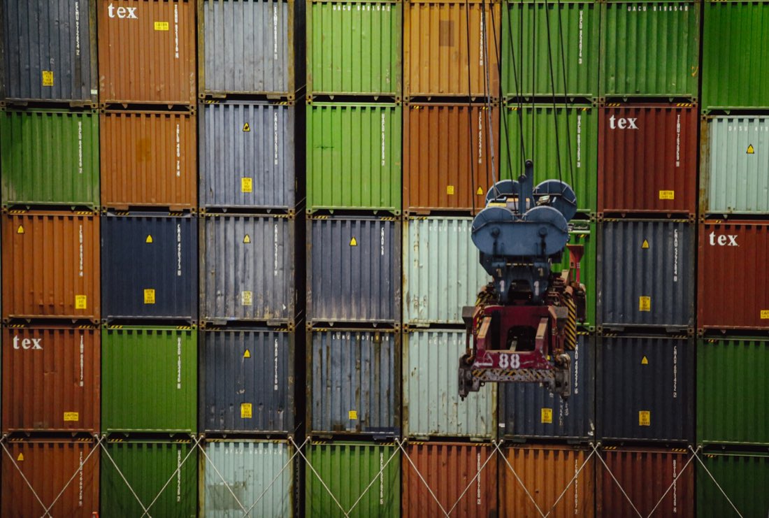 Stacked shipping containers awaiting clearance