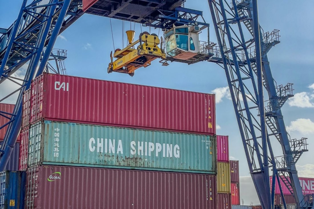 Crane lifting an oversized shipping container